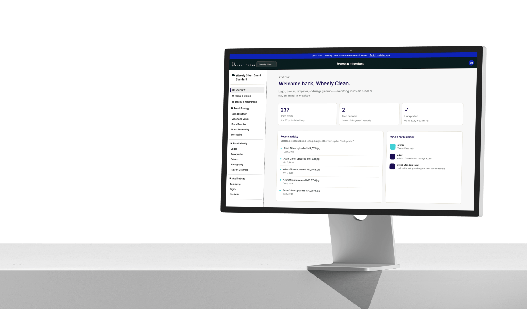 Wheely Clean's brand hub on a desktop monitor, open on its overview: brand assets, team members and recent activity